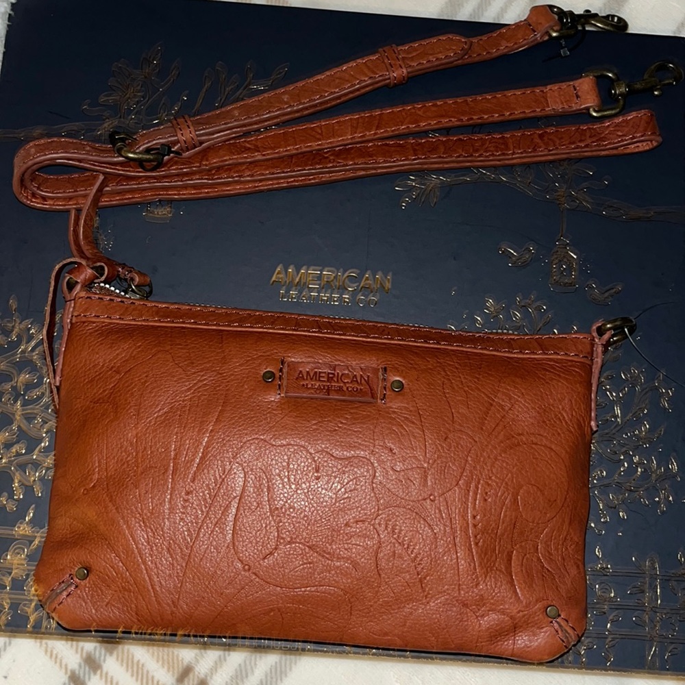 Leather purse with straps never used.